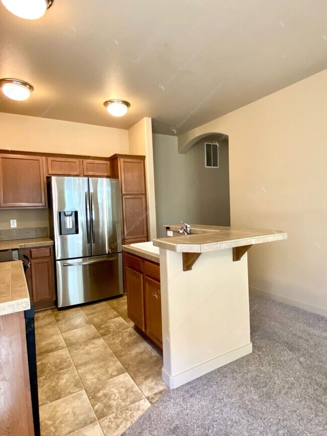 Building Photo - 3  BR home with new flooring in a great NE...
