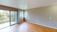 Located at 2355 Meadow Way in Santa Rosa, California, this single-floor apartment offers a well-organized layout with a clean, functional design throughout. The living area features warm hardwood-style flooring, neutral-toned walls, and a ceiling fan with light fixture, creating a bright and comfortable atmosphere. A sliding glass door opens to an outdoor view, allowing natural light to fill the space.

The kitchen is equipped with stainless steel appliances, including an electric range and an over-the-range microwave, set against crisp white cabinetry with modern hardware and light-toned granite-style countertops, providing ample workspace and storage.

The bedrooms are carpeted for comfort and each include ceiling fans and windows that bring in natural light. One bedroom features mirrored sliding closet doors that open to a well-sized closet with a built-in rod, along with a view of lush greenery outside. Another bedroom offers a window with a view of the outdoor pool area.

The bathroom is finished with hardwood-style flooring, a bathtub and shower combination with a glass enclosure, a vanity with matching countertops consistent with the kitchen, and wall-mounted lighting. A linen storage unit adds practical functionality to the space.