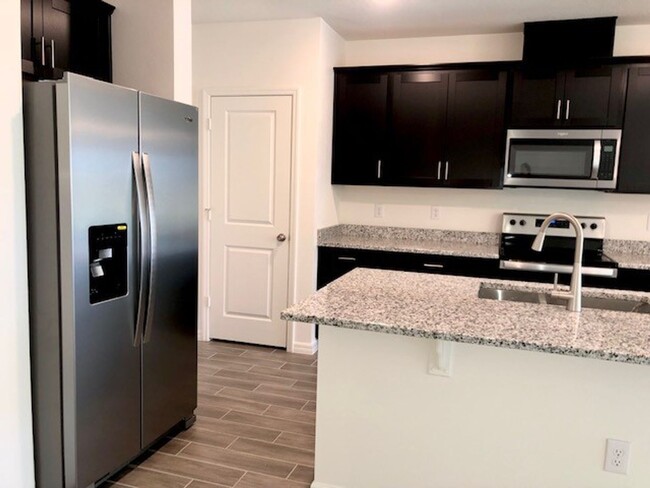 Building Photo - NEW 3 x2.5 TOWNHOME WITH 1 CAR GARAGE ATTA...