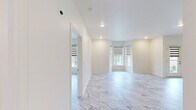Located in the Chenal Valley neighborhood of Little Rock, Arkansas, this thoughtfully designed 2-bedroom, 2-bathroom single-floor residence offers a clean, modern aesthetic throughout. Marble-look luxury flooring flows seamlessly from room to room, lending an air of elegance and continuity to the entire space.

The open-concept kitchen and living area serves as the heart of the home. The kitchen features dark cabinetry with sleek hardware, striking marble-look countertops, a large center island with pendant lighting, and a full suite of stainless steel appliances including a refrigerator, dishwasher, and range. The living room is bright and airy, with recessed lighting and dual-pane windows fitted with modern zebra-style roller shades that allow for versatile light control.

The spacious primary bedroom includes a ceiling fan, generous proportions, and access to a well-organized walk-in closet outfitted with wire shelving and basket storage. The bathrooms continue the marble-look flooring and feature dark vanities with stone-look countertops and tiled walk-in showers.

A dedicated laundry room provides added convenience with upper dark cabinetry for storage and washer/dryer hookups. The second bedroom also features a ceiling fan and a closet. Throughout the residence, crisp white walls, recessed lighting, and consistent finishes create a polished, cohesive living environment.