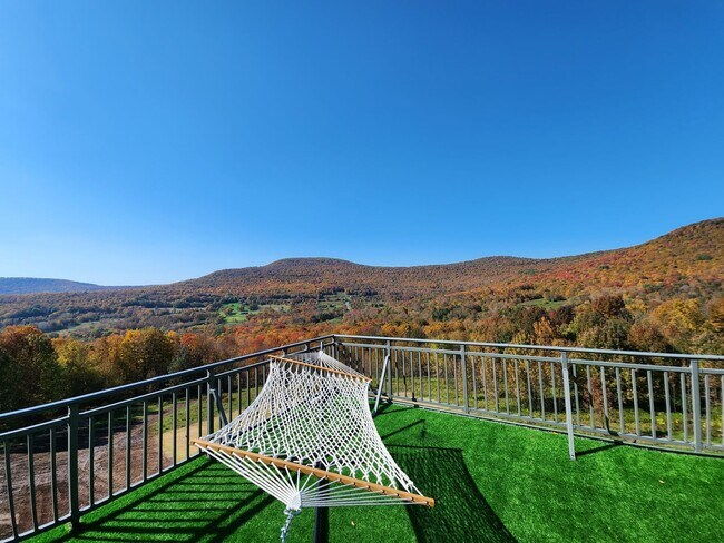 Building Photo - Modern Mountain Retreat with Rooftop Hot T...