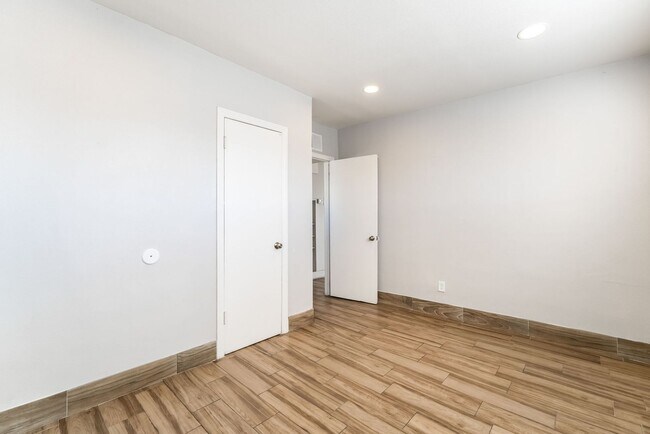 Building Photo - Chic Wood-Floored Haven with Carport!