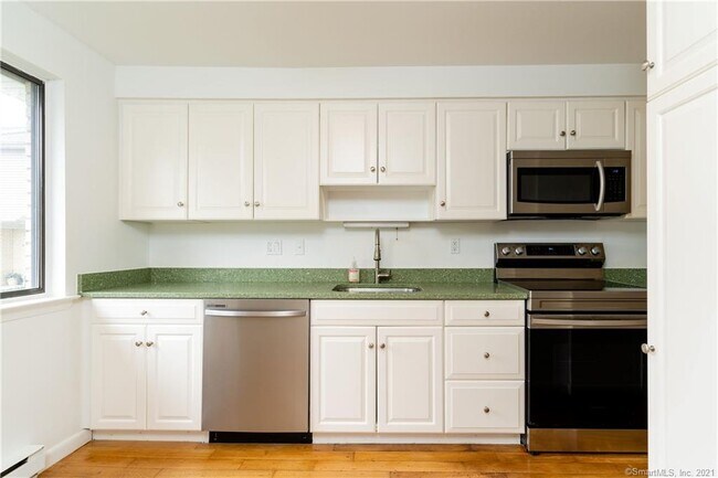 Kitchen with brand new stainless steel appliances - 10 Mead St