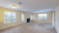 Located at 637 Stonebridge Way in Pleasant Hill, CA, this single-floor, one-bedroom, one-bathroom residence offers a comfortable and functional layout. The combined dining and living room serves as the heart of the home, featuring plush carpeting, warm neutral tones, and a tile-surround fireplace flanked by windows that fill the space with natural light. Sliding glass doors open directly to a private patio, extending the living area outdoors. The kitchen is equipped with white cabinetry, a dark countertop, a full suite of white appliances including a refrigerator, range, and microwave, and a breakfast bar that connects seamlessly to the living area. A dedicated laundry area adds everyday convenience. The bedroom offers a well-proportioned, carpeted retreat with ample wall space and multiple closets for generous storage throughout the unit. The bathroom includes a single-sink vanity with a dark countertop, white cabinetry, and a full shower-tub combo with a window for ventilation. Light hardwood-style flooring accents the kitchen and hallway, complementing the carpet found in the main living spaces. The entrance and hallway provide a smooth transition between rooms, giving the overall layout a cohesive and practical flow.