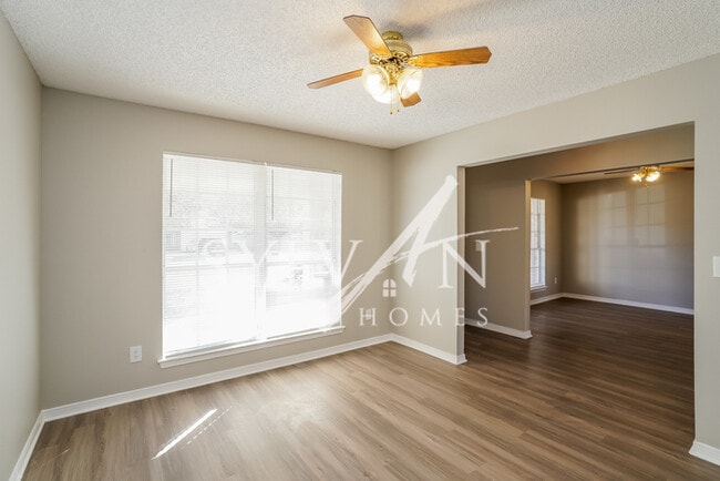 Building Photo - The living is easy in this 4 bedroom, 2 ba...