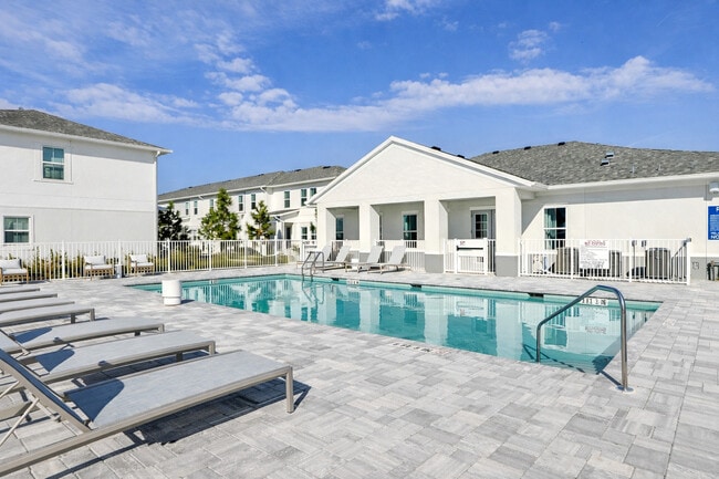 Swimming Pool with Lounge Chairs - Encanto Isla | Townhomes for Rent