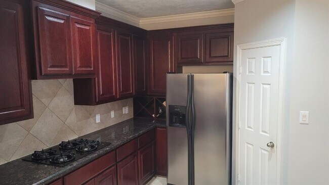 Kitchen with built in wine storage. - 1622 Cohn St
