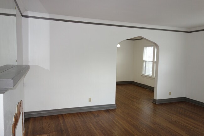 Living room with view into the dining room - 3287 E 2nd St S