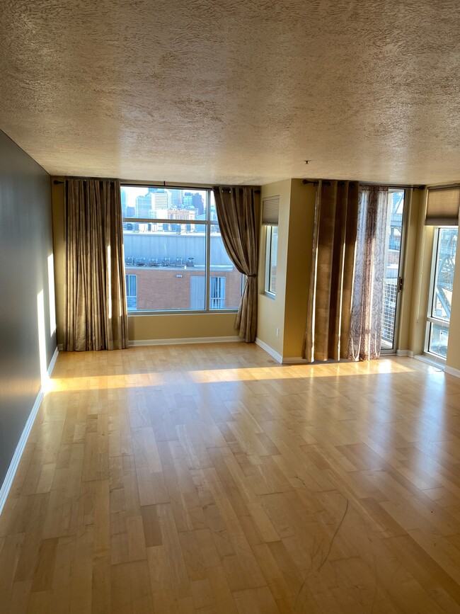 Living Room with Hardwood Flooring, Custom Drapes / Blinds and Private Balcony with City View - 2222 Detroit Ave