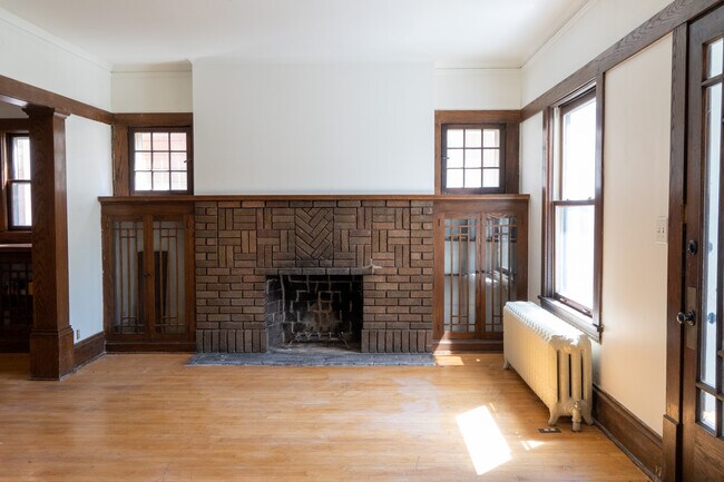 Living room w/ wood-burning fireplace in view - 4031 Blaisdell Ave