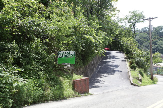 Entrance from Road - Palm Garden Apartments