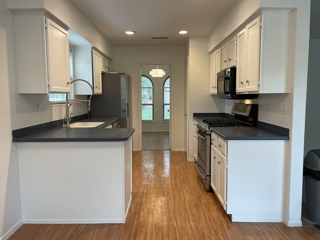 Kitchen (view from the eating area) - 6411 Earlyway Dr