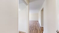 Located at 62 Manor Pkwy in Rochester, NY, this single-floor unit offers three bedrooms, one bathroom, a kitchen, a hallway, and an entrance within a compact and efficiently arranged floor plan. The layout is straightforward, with rooms connected via a central hallway.

The generously sized primary bedroom features warm, neutral-toned walls and smooth hardwood-style laminate flooring, lending it a clean and modern feel. The two additional bedrooms are finished with wall-to-wall carpeting in a neutral beige tone, providing a comfortable, cozy atmosphere. Each bedroom benefits from natural light through sizable windows fitted with blinds, offering both brightness and privacy. Several bedrooms also include closet access.

The kitchen is equipped with white cabinetry, a gas range, and dark laminate countertops. A window above the counter area allows natural light to fill the space while providing a view of the surrounding greenery outside.

The bathroom is finished in crisp white tones, featuring a vanity with storage, a toilet, and a window that brings in natural light while maintaining privacy.

Throughout the unit, warm beige walls create a consistent, neutral palette. The combination of laminate flooring in key areas and carpet in the bedrooms offers both practicality and comfort across this well-organized single-level home.