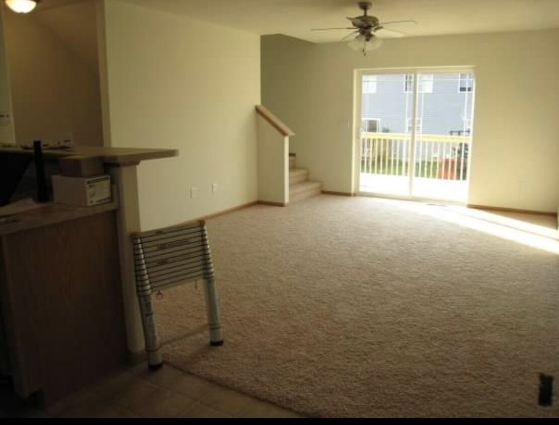Open floor plan. Sliding doors from living room to 10x10 deck - 1310 Talcott Ct