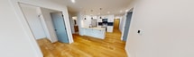 This contemporary apartment at 100 Fullarton Street, London ON, offers 720 square feet of efficiently designed living space. The unit features two bedrooms, including a primary bedroom of 130 square feet, and two full bathrooms. The open-concept layout combines the kitchen and living area, creating a spacious feel within the compact footprint.

The kitchen is a highlight, boasting modern white cabinetry, stainless steel appliances, and a contrasting dark backsplash. A central island with pendant lighting serves as both a prep area and casual dining space. Throughout the apartment, warm wood flooring adds a touch of natural elegance and continuity.

Large, floor-to-ceiling windows in the living area and bedrooms flood the space with natural light and offer stunning views of the surrounding cityscape. These windows lead to a private balcony, perfect for enjoying the urban vistas.

Both bathrooms feature sleek designs with glass-enclosed showers, modern fixtures, and clean lines. The apartment also includes a closet for additional storage. Recessed lighting throughout ensures a bright and inviting atmosphere at all hours.

This single-floor apartment combines functionality with style, making efficient use of its 720 square feet to create a comfortable and modern urban living space in the heart of London, Ontario.