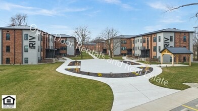 Building Photo - The Riv on the Greenway!