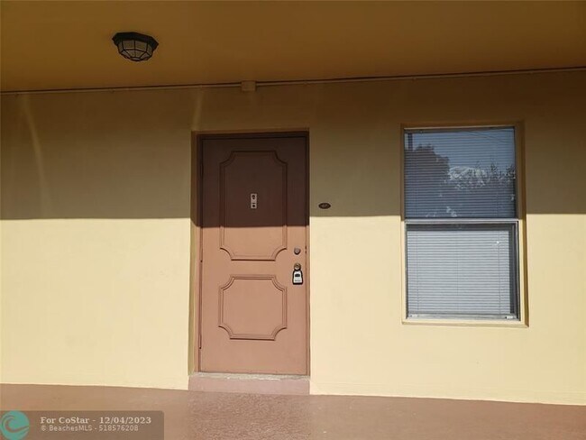 Building Photo - 6000 NW 64th Ave