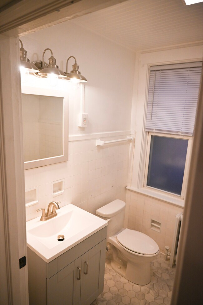 Bathroom features a shower and soaker tub - 1406 Mount Royal Blvd