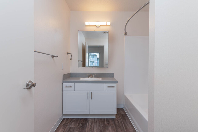 Fernwood | 1x1 Bathroom with white cabinetry - Fernwood Court Apartments