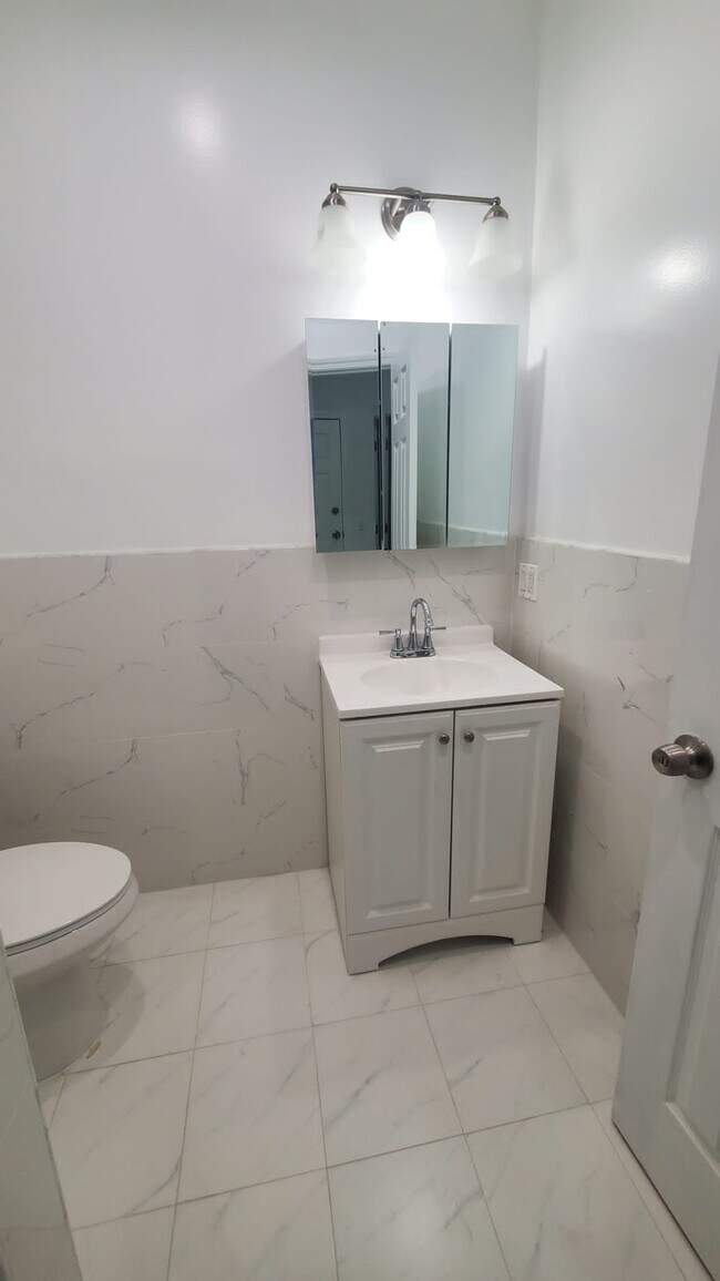 Beautiful bathroom with storage mirror - 3921 108th St