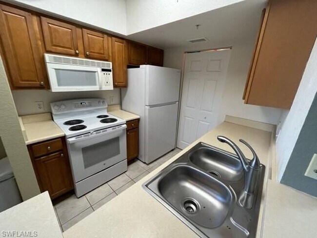 Building Photo - Gardens at Beachwalk - Unit 111