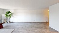 Located at 1175 Farmington Ave in Bristol, CT, this well-appointed residence offers three bedrooms, two bathrooms, and a thoughtfully arranged single-floor layout. The open kitchen is a standout feature, boasting white shaker cabinetry, granite countertops, a subway tile backsplash, and a full suite of stainless steel appliances including a refrigerator, range, and dishwasher. Wood-look flooring runs throughout the main living areas, lending a clean, cohesive aesthetic. The living room provides a generous, light-filled space with a neutral palette and baseboard heating. The spacious primary bedroom features hardwood-style flooring, ample wall space, and convenient closet access. Secondary bedrooms are carpeted and include built-in closets with dual hanging rods for practical storage. A dedicated walk-in closet offers additional shelving and hanging space. Both bathrooms are finished with granite-topped white vanities, tile accents, and wood-look flooring. A connecting hallway ties the layout together efficiently. Throughout the residence, the clean white walls, consistent finishes, and thoughtful use of space create a bright, comfortable, and move-in-ready environment suited for a variety of lifestyles.