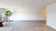 Located at 1175 Farmington Ave in Bristol, CT, this well-appointed residence offers three bedrooms, two bathrooms, and a thoughtfully arranged single-floor layout. The open kitchen is a standout feature, boasting white shaker cabinetry, granite countertops, a subway tile backsplash, and a full suite of stainless steel appliances including a refrigerator, range, and dishwasher. Wood-look flooring runs throughout the main living areas, lending a clean, cohesive aesthetic. The living room provides a generous, light-filled space with a neutral palette and baseboard heating. The spacious primary bedroom features hardwood-style flooring, ample wall space, and convenient closet access. Secondary bedrooms are carpeted and include built-in closets with dual hanging rods for practical storage. A dedicated walk-in closet offers additional shelving and hanging space. Both bathrooms are finished with granite-topped white vanities, tile accents, and wood-look flooring. A connecting hallway ties the layout together efficiently. Throughout the residence, the clean white walls, consistent finishes, and thoughtful use of space create a bright, comfortable, and move-in-ready environment suited for a variety of lifestyles.