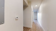 Located at 6215 Via La Cantera in San Antonio, TX, this one-bedroom, one-bathroom residence offers a well-designed single-floor layout that maximizes every square foot. The open-concept living, dining, and kitchen area forms the heart of the home, finished with light wood-tone flooring that lends warmth and continuity throughout. The kitchen is a standout feature, outfitted with dark espresso cabinetry, stainless steel appliances including a range, microwave, dishwasher, and refrigerator, a mosaic tile backsplash, and granite countertops. Track lighting and a ceiling fan complete the functional yet stylish space. A private balcony extends the living area outdoors, providing a pleasant retreat. The bedroom offers plush carpeting and a ceiling fan, creating a comfortable and quiet environment. A dedicated closet provides organized storage, accessible via a clean, well-lit hallway equipped with a programmable thermostat. The bathroom features a full tub-shower combo, a granite-topped vanity with dark cabinetry, brushed nickel fixtures, and tile flooring, delivering a polished, cohesive finish. Crisp white walls throughout the unit enhance the sense of openness and light.