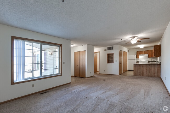 2BR, 1BA - 1000SF - Living Room and Kitchen - Cottages of White Bear Lake Township