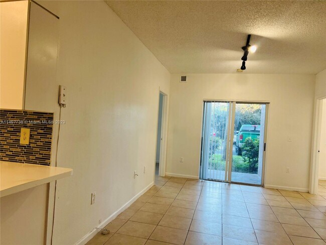 Building Photo - 3221 Sabal Palm Manor