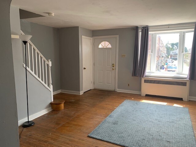 Living room - bay window, closet and stairs - 3425 Verner St