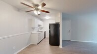 Located at 644 Glastonbury Road in Nashville, TN, this one-bedroom, one-bathroom unit offers a practical and efficiently designed single-floor layout. Light wood-style flooring runs throughout the space, creating a clean, cohesive look across all rooms.

The open-concept kitchen, dining, and living area forms the heart of the unit. The kitchen features white cabinetry, white countertops, a stainless steel sink, and appliances including a refrigerator and range. A ceiling fan with a light fixture overhead keeps the living area comfortable and well-lit.

The bedroom is a well-proportioned retreat with a ceiling fan, two windows that invite natural light and views of surrounding greenery, and direct access to two closets. The bathroom is accessible from the bedroom and includes a full tub-shower combination with clean white surround and chrome fixtures.

Additional practical features include an in-unit laundry area and a wall-mounted HVAC unit visible in the living space. Neutral wall tones and white trim throughout the unit contribute to a bright, versatile interior that is easy to personalize. The overall design prioritizes functionality, making efficient use of the available space for comfortable everyday living.