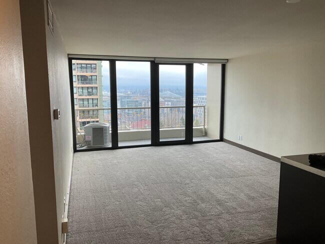 Living room with deck access (new roller blinds) - 255 SW Harrison St