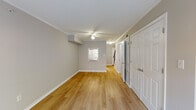Located at 2633 Gloucester Rd in Augusta, Georgia, this two-story home offers a well-organized layout across two levels. The main living area features light-toned hardwood-style flooring, neutral gray walls, and crown molding that lends a clean, polished finish throughout. A ceiling fan provides added comfort, while a window and a sliding glass door open to an outdoor fenced area, allowing natural light to fill the space.

The kitchen is equipped with warm honey-toned wood cabinetry, granite-look countertops, a stainless steel sink, and white appliances including a refrigerator, range with microwave above, and dishwasher. The layout makes efficient use of the available space for everyday cooking and meal prep.

Bedrooms are carpeted for added comfort and include ceiling fans, windows for natural light, and closets with double-panel doors for practical storage. The bathroom is neatly appointed with a full tub and shower combination, tile flooring, and a vanity with mirror.

Throughout the home, consistent neutral tones, clean white trim, and well-maintained finishes create a cohesive and move-in ready atmosphere. The two-floor configuration provides a functional separation of living and private spaces, making this home in Augusta a practical and comfortable residence.