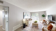 Located at 2946 Francis St in Kansas City, KS, this single-floor home offers three bedrooms, two bathrooms, and a thoughtfully arranged layout. The living room is a bright and welcoming space, featuring a large sliding glass door with vertical blinds that flood the room with natural light and provide views of lush outdoor greenery. Neutral-toned carpet and a textured ceiling complete the comfortable atmosphere.

The dining area flows seamlessly into the kitchen, which features warm wood cabinetry, granite-style countertops, a stainless steel refrigerator, and a black electric range. Light wood-style flooring runs throughout the kitchen and dining space, adding a modern contrast to the classic cabinetry.

The primary bedroom offers a generous layout with a double-door closet and soft carpeting. Additional bedrooms are well-sized, each with closet access and carpet flooring, suitable for a variety of uses. The two bathrooms are clean and functional — one features a wood-vanity with a lighted mirror and wood-look flooring, while the other includes a full tub-shower combination.

A connecting hallway ties the rooms together efficiently, making this home a practical and comfortable residence in an established Kansas City neighborhood.