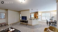 Located at 527 Cosgrove Ave in Chapel Hill, NC, this well-appointed 2-bedroom, 2-bathroom residence offers a thoughtfully designed single-floor layout. The open-concept living and dining areas are finished with plush wall-to-wall carpeting and elegant crown molding, creating a warm and cohesive atmosphere. A peninsula kitchen with warm wood cabinetry, granite-look countertops, stainless steel appliances, and pendant lighting connects seamlessly to the main living space, making it ideal for both everyday living and entertaining. Natural light filters through multiple windows, enhancing the bright, neutral color palette throughout. The generously sized primary bedroom features a ceiling fan, a large window with outdoor views, and comfortable carpeted flooring. The bathrooms are finished with tile flooring, warm wood vanities, and wide vanity mirrors with overhead lighting. A dedicated in-unit laundry room accommodates a full-size washer and dryer with additional shelving for storage. A connecting hallway ties the layout together efficiently, while the exterior features classic horizontal lap siding. This residence offers a comfortable and functional living environment in a convenient Chapel Hill location.