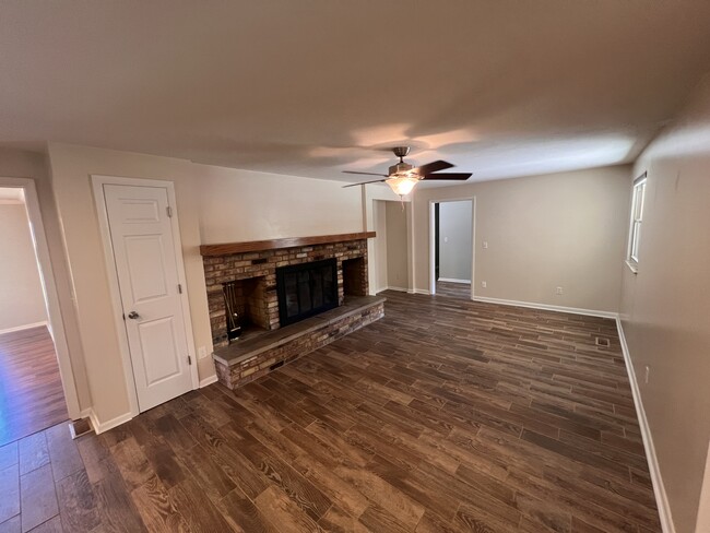 Living room with working wood fireplace. - 1298 Cedarcliff Dr