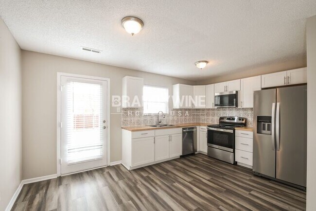 Building Photo - Step into Your New Home! Tour & Apply Now!...