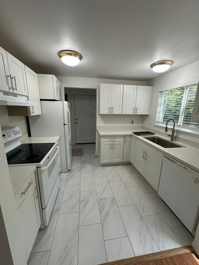 Quartz Counters, Tile Floors - NEW - Sunset Apartments