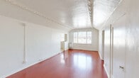 Located at 475 S New Hampshire Ave in the heart of Los Angeles' Koreatown neighborhood, this one-bedroom, one-bathroom unit offers a well-organized single-floor layout with thoughtful details throughout. The spacious bedroom is a standout feature, showcasing warm hardwood flooring and distinctive ornate crown molding that adds a classic architectural character to the space. Natural light filters in through a large multi-pane window, creating a bright and airy atmosphere, while a wall-mounted heater ensures year-round comfort. The galley-style kitchen is efficiently designed with white cabinetry, tiled countertops accented by a black-and-white geometric pattern, a stainless steel gas range, and light tile flooring — offering a clean, functional workspace. The bathroom retains a timeless aesthetic with a pedestal sink, a soaking tub, white wall tiling with a dark border detail, classic black-and-white floor tiles, and a window that brings in natural light. Two closets provide convenient storage, and a connecting hallway ties the rooms together seamlessly. Overall, the unit blends vintage architectural details with practical living spaces in a compact, efficient footprint.