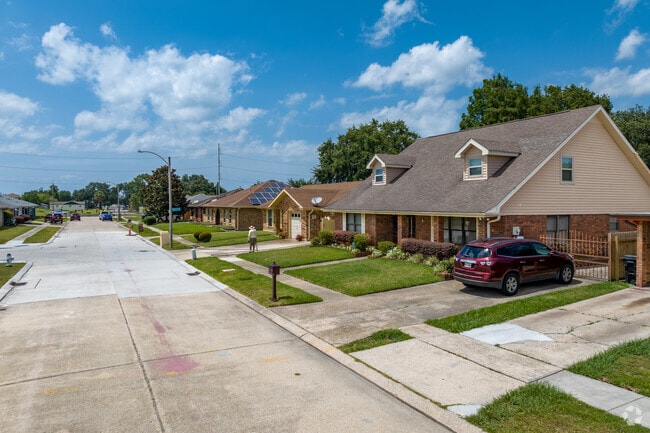 Tree-lined streets are common across Little Woods.