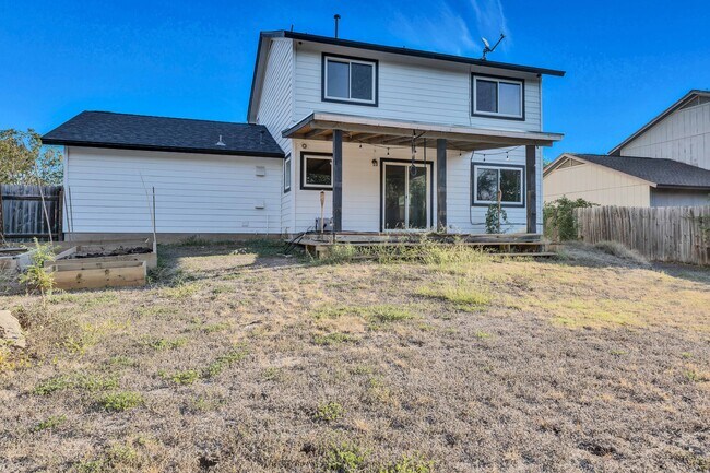 Back deck with gardens - 4601 Sidereal Dr