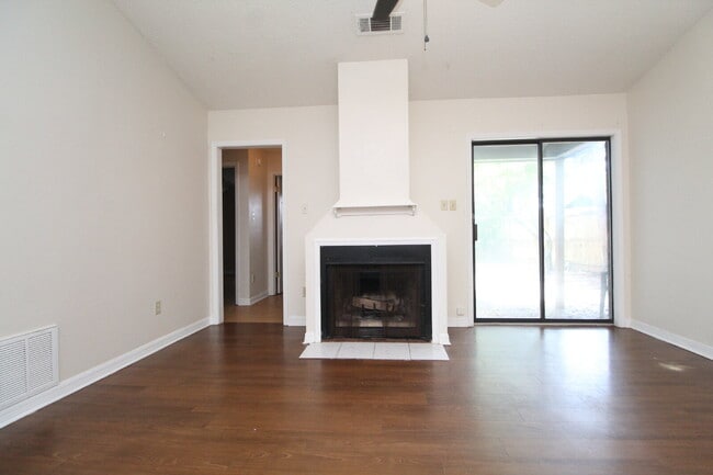 Building Photo - 2BR Home with Wood-Look Flooring, Fenced Backyard & Private Patio