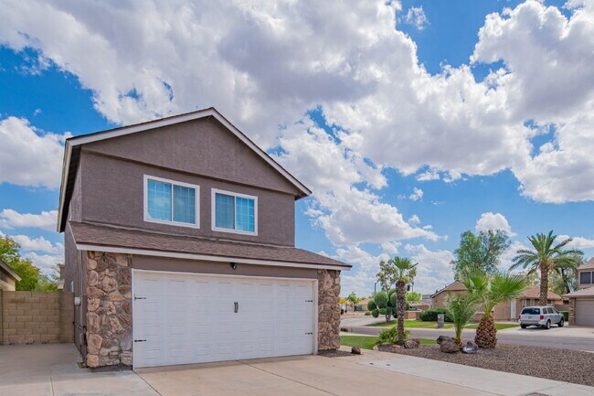 Photo - "Spacious 4-Bed Oasis with 3.5 Baths in Charming Glendale Locale – 10615 N 63rd Dr!" Apartment