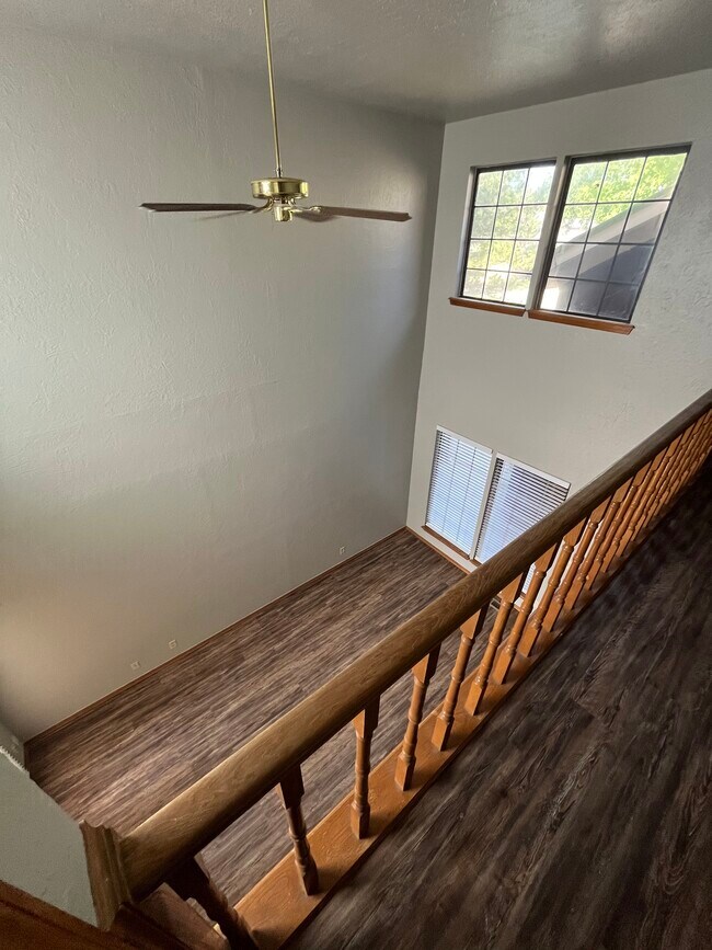 View of living room from upstairs hallway - 311 Lamp Post Rd