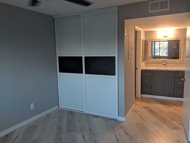 Bedroom #1 and vanity for bathroom. Full bathroom in adjoining door - 4205 Ohio St