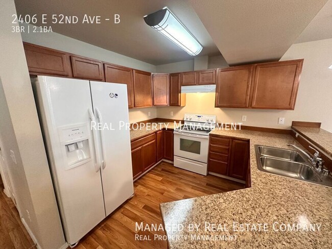 Building Photo - 2406 E 52nd Ave