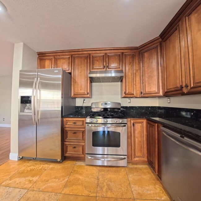 Building Photo - Stunning 2-Story Home with a Bedroom downstairs and a Backyard Oasis.