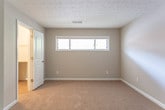 Located at 730 Franklin Rd SE in Marietta, Georgia, this single-floor residence offers a well-organized layout with a variety of functional and comfortable living spaces. The open living and dining area is highlighted by a striking stone-surround fireplace with a clean white mantel, adding both warmth and character to the space. Soft carpeting flows through the living areas and bedrooms, while wood-style plank flooring runs through the kitchen, dining, and wet areas, providing a cohesive and durable aesthetic throughout.

The kitchen is thoughtfully appointed with dark espresso cabinetry, granite-style countertops, black appliances including a range and over-the-range microwave, and a stylish mosaic tile backsplash that adds visual interest. A pendant light fixture over the dining area completes the kitchen-to-dining transition.

The bedrooms are generously proportioned, each featuring plush carpeting, textured ceilings, and windows that allow natural light to filter in. The bathrooms are finished with dark vanity cabinetry, granite-style countertops, and full tub-shower combinations with coordinating fixtures, maintaining a consistent design language found throughout the home. Overall, the residence presents a clean, neutral palette with modern finishes.