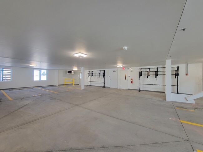 Parking garage with bicycle racks - The Commons at Pointe Plaza